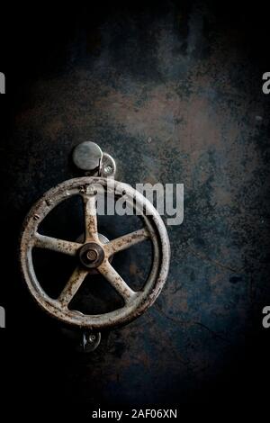 Old safe doors with a lock and rustt-eaten background Stock Photo