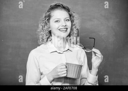 energy and vigor. energy charge. good morning. girl refreshing with tea drink. school teacher need coffee break. idea and inspiration. woman with coffee cup at blackboard. Early morning. Stock Photo