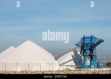 Mounds of sea salt beside the salt pans Bras del Port in Santa Pola, Spain. Stock Photo