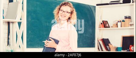 Teacher pretty woman enjoy educational process. onstantly learning new skills. Girl adorable teacher in classroom. Formal education. Teachers day. Teacher difficult but very rewarding profession. Stock Photo