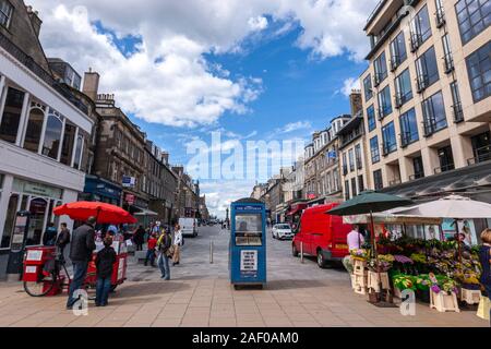 The Scotsman newspaper kiosk and flower stall in Castle St from Princes St, Edinburgh, Scotland, UK Stock Photo