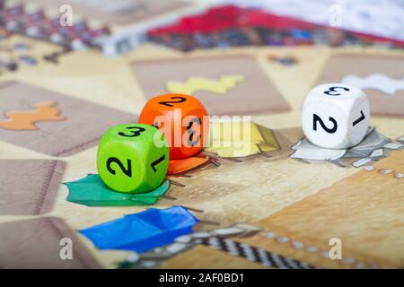Close-up multi-colored board game with chips and dice, the concept of an interesting family leisure, selective focus Stock Photo