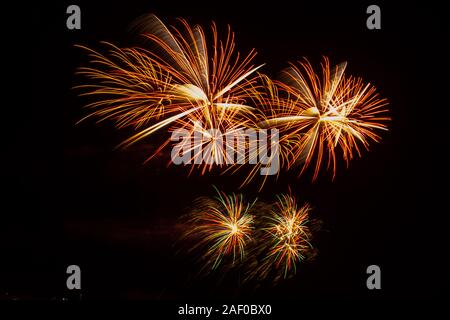 Bright colourful exploding fireworks on a black background Stock Photo