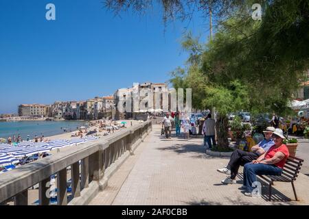 The beachfront in and the Old Town in Cefalù, Sicily. Historic Cefalù is a major tourist destination on Sicily. Stock Photo