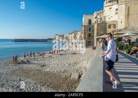 The beachfront in Cefalù, Sicily. Historic Cefalù is a major tourist destination on Sicily. Stock Photo