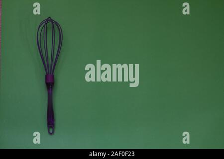 Green Plastic Kitchen Whisk Isolated On White Stock Photo, Picture and  Royalty Free Image. Image 25474095.