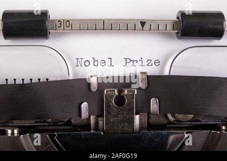 The inscription 'nobel prize' on a white sheet in a typewriter. Nobel prize in literature. Light background. Stock Photo