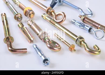 various metal fixing anchors on white background Stock Photo
