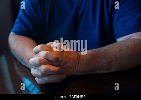 senior man communicating with hand gestures Stock Photo