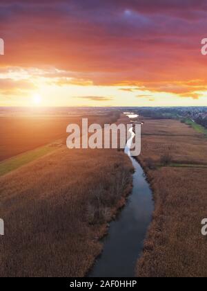 Aerial view of sunset river. Drone flying over the river Tisza in Hungary Stock Photo