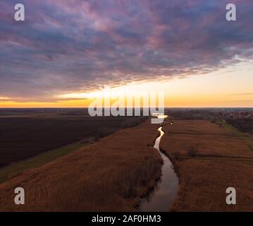 Aerial view of sunset river. Drone flying over the river Tisza in Hungary