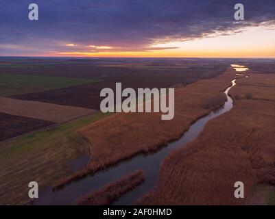 Aerial view of sunset river. Drone flying over the river Tisza in Hungary Stock Photo