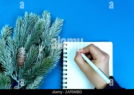 Man writes plans and goals. Stock Photo
