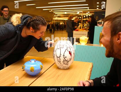 Prague, Czech Republic. 11th Dec, 2019. A visitor looks at a vase at the exhibition of Czech Design Week in Prague, the Czech Republic, Dec. 11, 2019. The Czech Design Week brings together the works of more than 150 designers from around the world, and also hosts a series of lectures and forums. The entire event will last till the Dec. 15. Credit: Dana Kesnerova/Xinhua/Alamy Live News Stock Photo