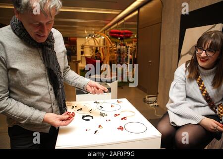 Prague, Czech Republic. 11th Dec, 2019. An exhibitor displays his jewelry collection at the exhibition of Czech Design Week in Prague, the Czech Republic, Dec. 11, 2019. The Czech Design Week brings together the works of more than 150 designers from around the world, and also hosts a series of lectures and forums. The entire event will last till the Dec. 15. Credit: Dana Kesnerova/Xinhua/Alamy Live News Stock Photo