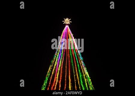 Colorful lights in a Christmas tree with star at the top at Remate de Paseo Montejo, Merida, Yucatan, Mexico Stock Photo