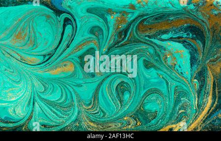 Green and gold ripple of agate background. Golden powder marble texture. Stock Photo