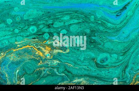 Green and gold ripple of agate background. Golden powder marble texture. Stock Photo