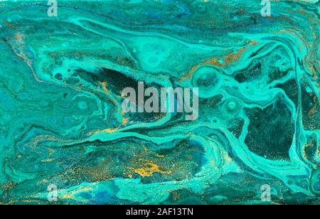 Green and gold ripple of agate background. Golden powder marble texture. Stock Photo