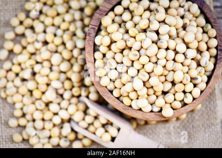 Soybean on bolw and the sack background top view / dry soy beans , soya beans Stock Photo