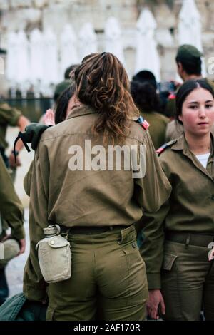 Jerusalem Israel December 11, 2019 View of Israeli soldiers standing front the Western Wall of the old city of Jerusalem on the evening Stock Photo