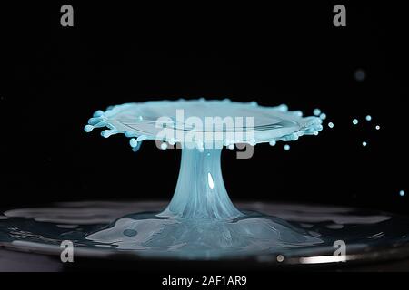 High resolution high megapixel image of a water drop splash with  blue, and baby blue, representing themes of change, impact, gender, boy Stock Photo