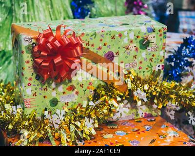 Colorful gift box background. Cute present boxes with colorful bows and ribbons in happy new year party. Stock Photo