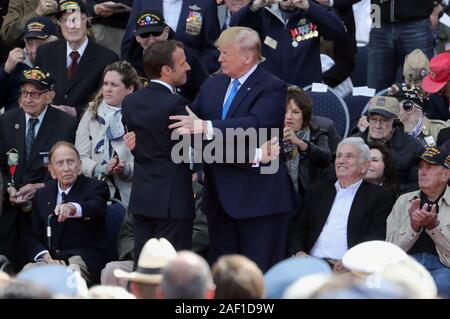 Paris, France. 12th Dec, 2019. United States President Donald Trump greets French President Emmanuel Macron during the commemoration ceremony of the 75th anniversary of the D-Day landing at WWII's Normandy American Cemetery and Memorial in Colleville-sur-mer, France, on June 6, 2019. Many veteran soldiers attended the ceremony. Photo by Eco Clement/UPI Credit: UPI/Alamy Live News Stock Photo