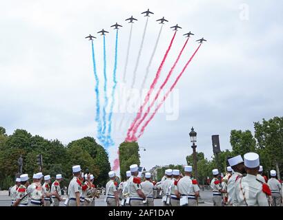 Paris, France. 12th Dec, 2019. French soldiers watch a flyover by French military jets during the annual Bastille Day military parade along the Avenue des Champs-Elysees in Paris on July 14, 2019. Photo by David Silpa/UPI Credit: UPI/Alamy Live News Stock Photo