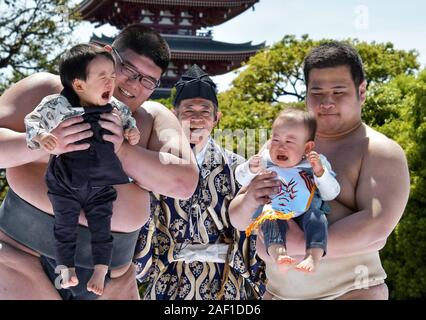 Tokyo, Japan. 12th Dec, 2019. A baby held by an amateur sumo wrestler cries during the 'baby crying contest (Naki Sumo)' at the Sensoji temple in Tokyo, Japan, on April 28, 2019. This contest takes place for parents wishing good health and strength for children since 1986. Photo by Keizo Mori/UPI Credit: UPI/Alamy Live News Stock Photo