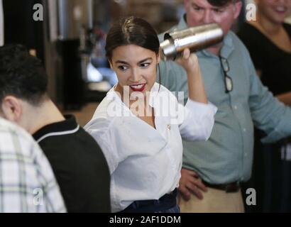 Queens, United States. 12th Dec, 2019. U.S. Representative Alexandria Ocasio-Cortez mixes a drink while bartending at The Queensboro Restaurant on May 31, 2019, in New York City. Ocasio-Cortez returned to bartending for one day to show solidarity with restaurant and tipped workers. Photo by John Angelillo/UPI Credit: UPI/Alamy Live News Stock Photo