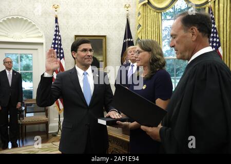 Washington, United States. 12th Dec, 2019. U.S. President Donald Trump looks on as Mark Esper is sworn in by Supreme Court Justice Samuel Alito as new Defense Secretary in the Oval Office of the White House in Washington on Tuesday, July 23, 2019. Photo by Yuri Gripas/UPI Credit: UPI/Alamy Live News Stock Photo
