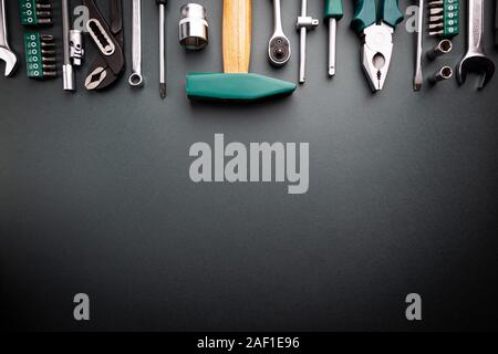 Set of tools over black background, top view with space for text Stock Photo