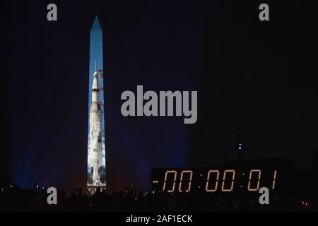 Washington, United States. 12th Dec, 2019. The Saturn V rocket that launched Apollo 11, part of 'Apollo 50: Go for the Moon,' a special 17-minute show, is projected onto the east face of the Washington Monument in Washington, DC on July 19, 2019. The Smithsonian and NASA are celebrating the 50th anniversary of the Apollo 11 mission that took man to the moon. Neil Armstrong, Buzz Aldrin, and Michael Collins took off from Earth on July 16, 1969, and Armstrong and Aldrin landed on the moon on July 20, 1969. Photo by Pat Benic/UPI Credit: UPI/Alamy Live News Stock Photo