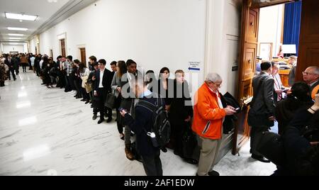 Washington, United States. 12th Dec, 2019. People wait to enter before Michael D. Cohen testifies before the House Oversight Committee on February 27, 2019, in Washington, DC Cohen, once one of President Trump's most trusted aides and lawyers, took the witness stand for his first and only public appearance before Congress on Wednesday to discuss the President's character and possible criminal conduct. Photo by Pat Benic/UPI Credit: UPI/Alamy Live News Stock Photo