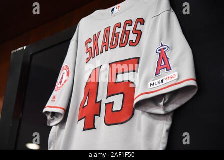 Arlington, United States. 12th Dec, 2019. The jersey of pitcher Tyler Skaggs hangs on the wall during a pregame press conference at Globe Life Park in Arlington, Texas, on July 2, 2019. Skaggs, 27, was found dead at a North Texas hotel Monday while the team is in town for a series against the Texas Rangers. No foul play is suspected, and the teams postponed Monday's game. Photo by Ian Halperin/UPI Credit: UPI/Alamy Live News Stock Photo