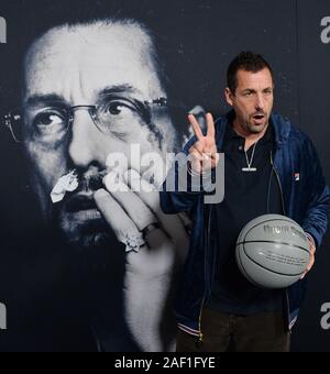 Hollywood, California, USA. 12th Dec, 2019. Hollywood, California, USA. 11th Dec, 2019. Cast member Adam Sandler attends the premiere of the motion picture crime thriller 'Uncut Gems' at the ArcLight Cinema Dome in the Hollywood section of Los Angeles on Wednesday, December 11, 2019. Storyline: Howard Ratner (Adam Sandler), a charismatic New York City jeweler always on the lookout for the next big score. Credit: UPI/Alamy Live News Stock Photo