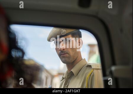 Leh, Jammu and Kahmir, India - July 27, 2011: Indian traffic policeman at work in Leh, former capital of Ladakh, today part of Jammu and Kashmir Stock Photo