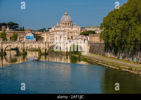 The Papal Basilica of St. Peter, St. Peter's Basilica and the bridge Ponte Sant'Angelo, seen across the river Tiber Stock Photo