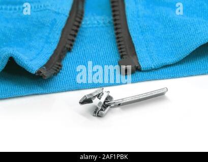 Blue hoody with broken zipper. Detail close-up photo Stock Photo