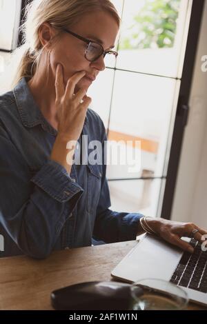 Woman using laptop Stock Photo