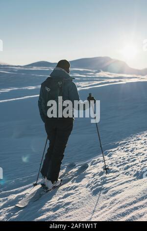 Skier in mountains Stock Photo