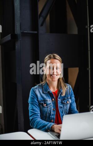 Woman working on laptop Stock Photo