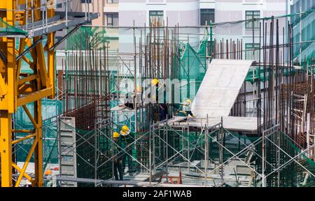Construction work and large crane working on new Hilton Hotel Ho Chi Minh City formerly Saigon Stock Photo