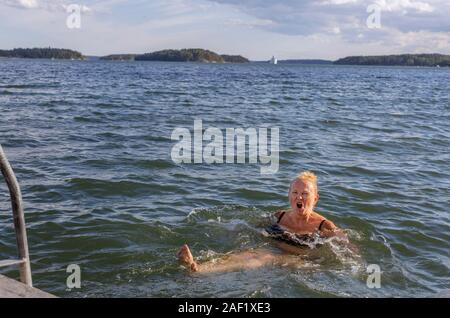 Woman swimming in sea Stock Photo