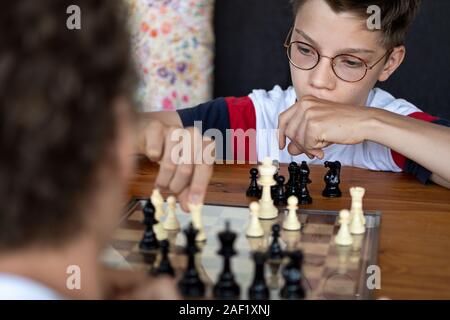 Boy playing chess Stock Photo