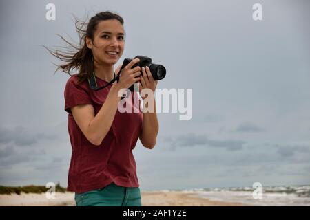 Female photographer with camera Stock Photo