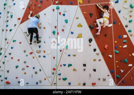 Mother with daughter on climbing gym Stock Photo