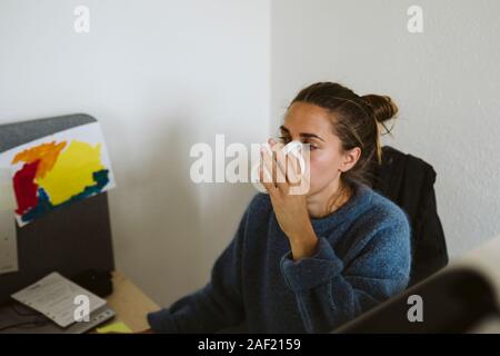 Woman having coffee in office Stock Photo