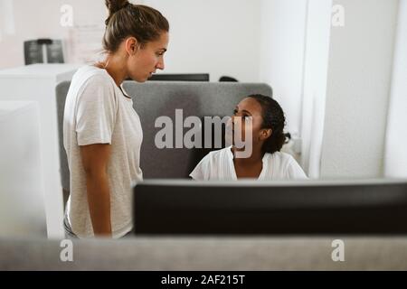 Women talking in office Stock Photo